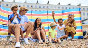 Family enjoying time on the beach in the UK